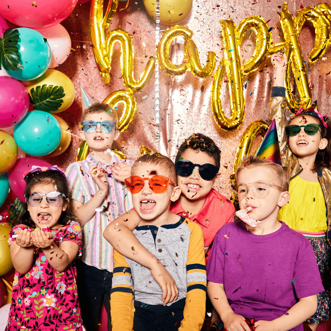 Children smiling and laughing together at a kids party at Pinstripes.